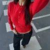 Gestreifte Jacke mit Rundhalsausschnitt und Knopfleiste Gestreifte Jacke mit Rundhalsausschnitt und Knopfleiste