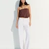 Hoch taillierte, schimmernde Straight-Leg-Jeans Hoch taillierte, schimmernde Straight-Leg-Jeans