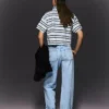 Hoch taillierte, Straight geschnittene Jeans mit Wide Leg und umgeschlagenem Saum – Hose