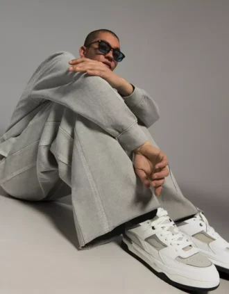 Sneaker mit voluminöser Sohle und Applikationen – Sneaker